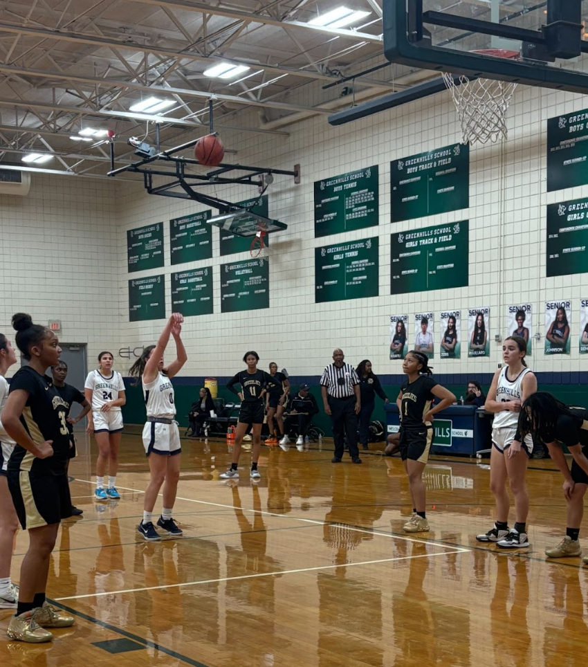 MUSCLE MEMORY Maldonado shoots a free throw after being fouled at the home basketball game against Ypsilanti Community School. “When I take my free throws I don’t think,” said Maldonado. “I just follow my routine and make sure I dribble twice before making my shot.”